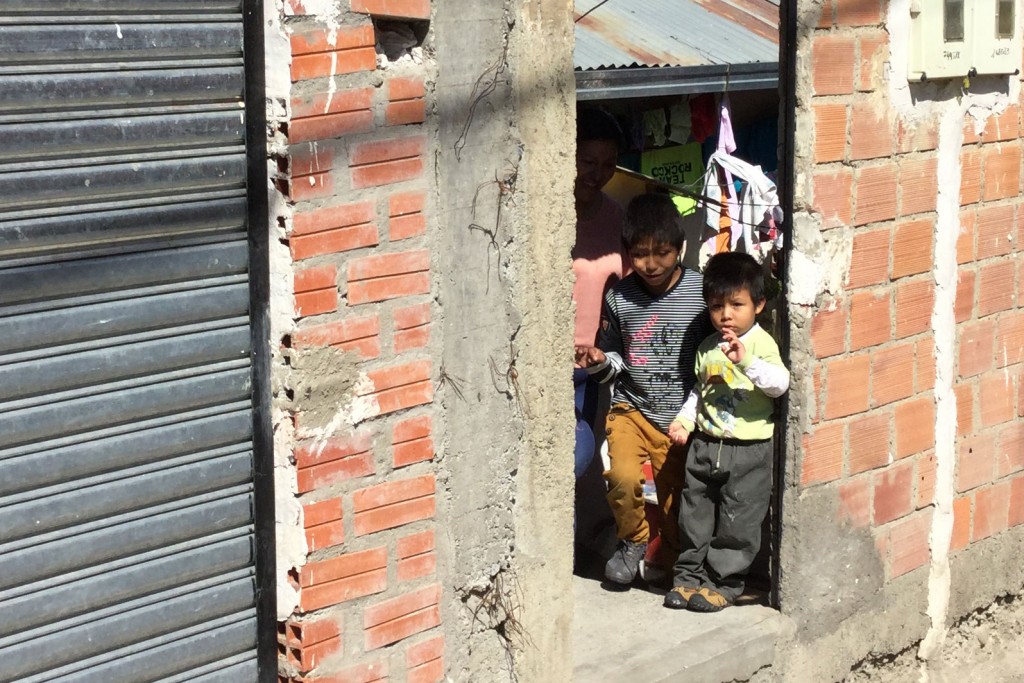 Efrain and his family in their doorway